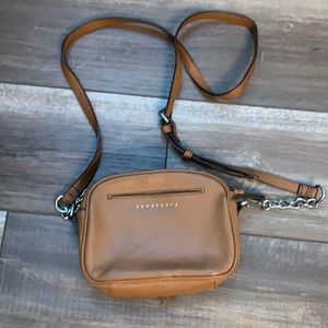 Sanctuary crossbody maple colored bag.